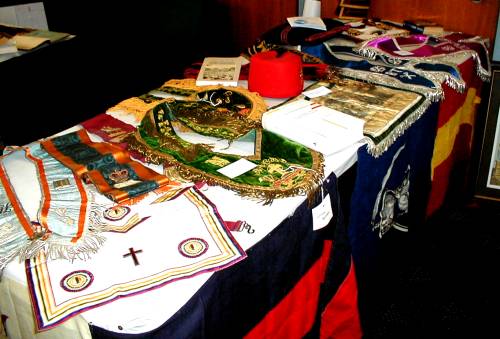 Table with various collar and apron regalia